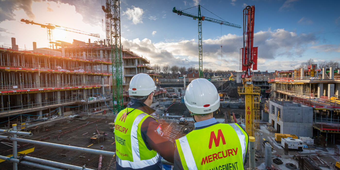 Mercury staff members looking out at a constructiion site