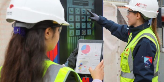 Two Mercury team members at a digital kiosk in a European Data Centre