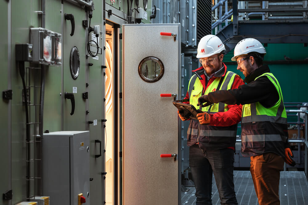 Two Mercury staff members at a site